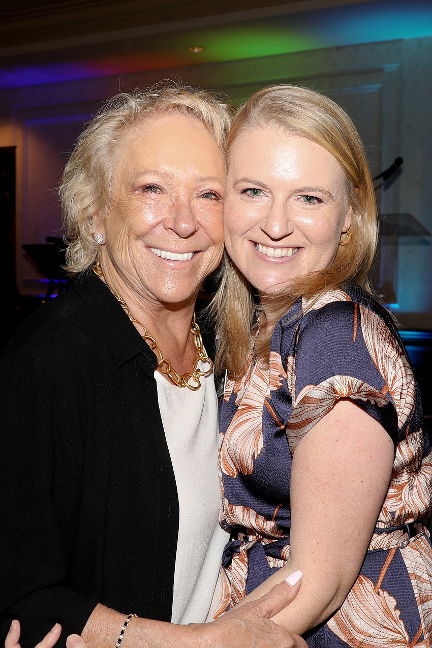 Sherry Koski and Nicole Eibe share a quick hug.
