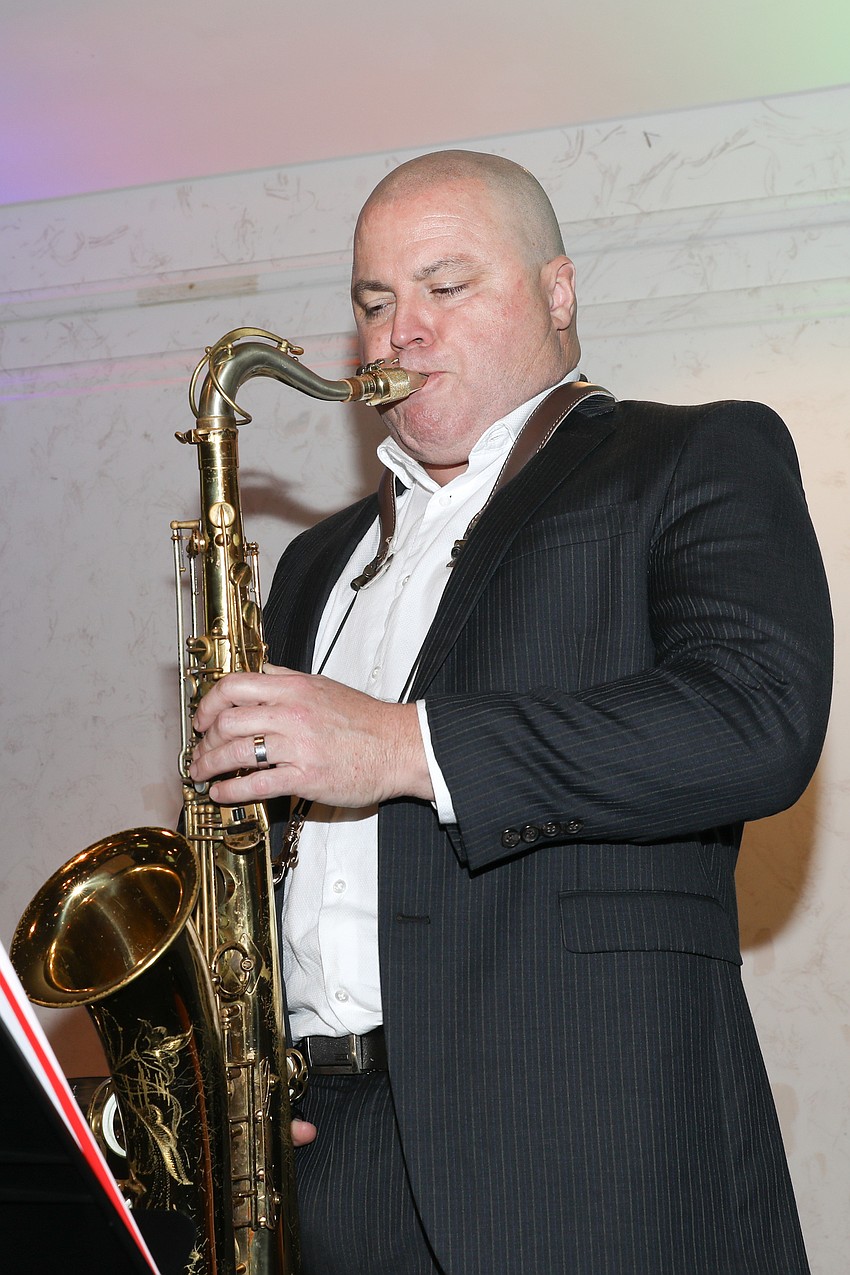 Pete Carney and his sax perform with the John Miller Jazz Ensemble.