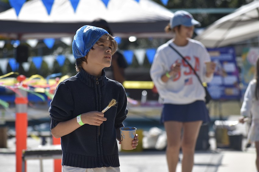 Sebastian Works, 7 and his mother Sheena Works approach the mural.