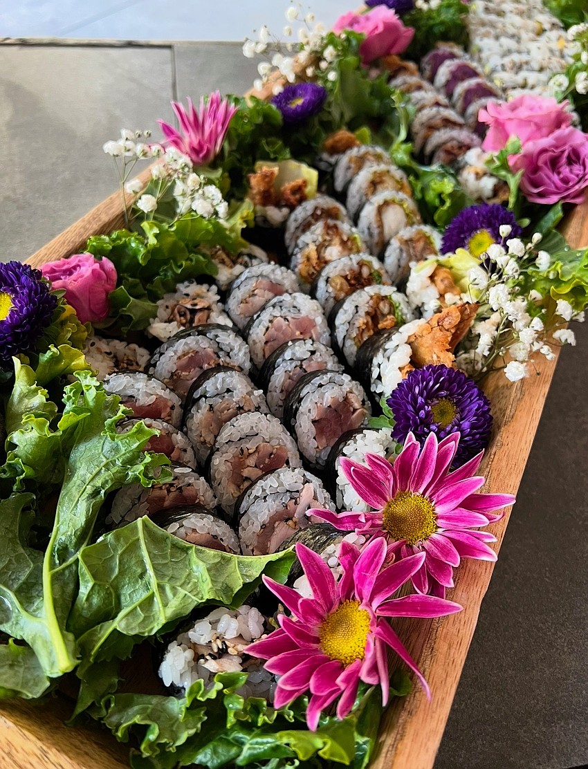 A series of sushi rolls from the restaurant are displayed.