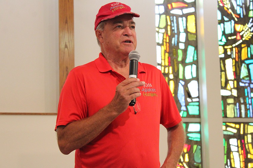 Kids Against Hunger Executive Director Todd Clevenger thanks volunteers for their assistance at the food packing event.