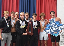 Sarasota boys' swimming poses for a photo on Nov. 14 at Florida Aquatics Swimming and Training in Ocala after winning the title. From left: Cy Matteson, Jackson Irwin, Adam Malaj, Bogdan Zverev, Daniil Siutsou, Daniel Keegan, Jack Sallee and Andrew Malaj (Charles Shoemaker not pictured).