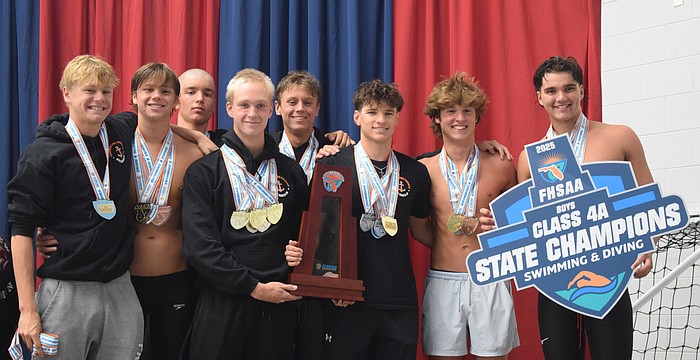 Sarasota boys' swimming poses for a photo on Nov. 14 at Florida Aquatics Swimming and Training in Ocala after winning the title. From left: Cy Matteson, Jackson Irwin, Adam Malaj, Bogdan Zverev, Daniil Siutsou, Daniel Keegan, Jack Sallee and Andrew Malaj (Charles Shoemaker not pictured).