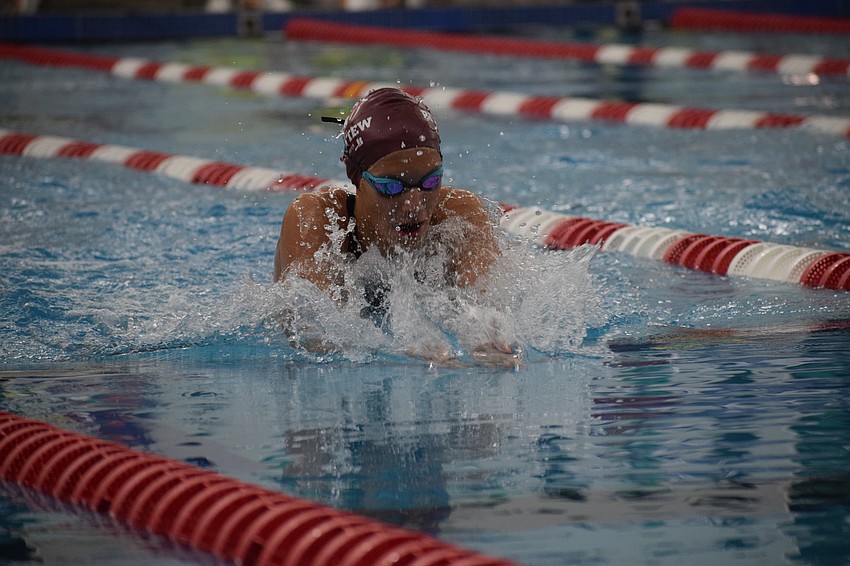 Freshman Sydney Hardy swims the 100-yard breaststroke. Not only did she beat senior teammate Danica Aten for first in that event, but she also finished with four medals overall in her first FHSAA state meet.