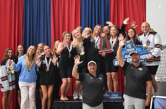 Members of Riverview girls' swimming put up five fingers representing their number of state titles since 2021. For the first time in program history, they've won five in a row.