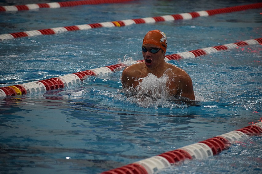 Junior Jackson Irwin swims the breaststroke during the 200-yard individual medley. He finished the state meet with three medals in all, the second-most among all Sailors.