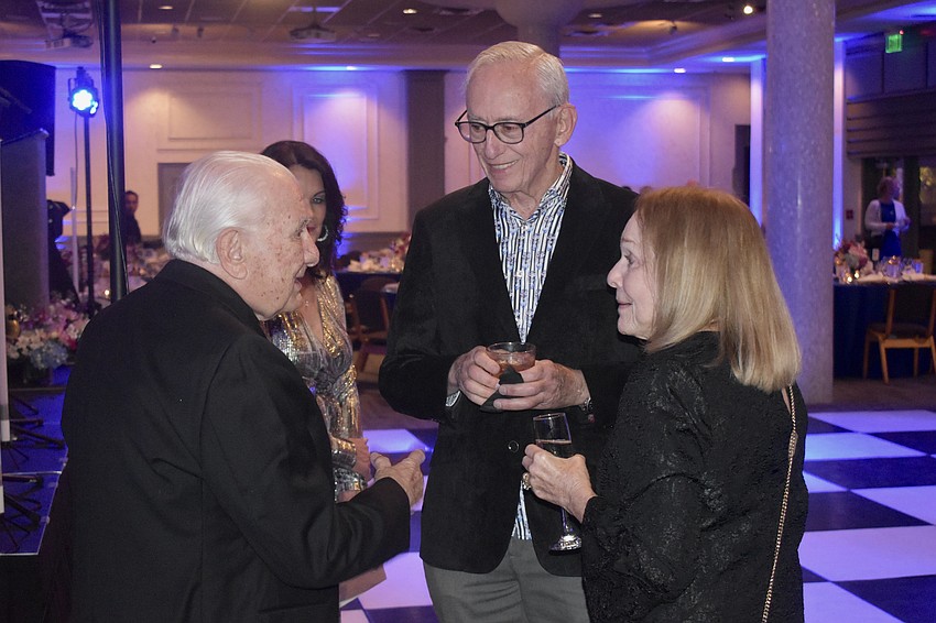 Rev. Fausto Stampiglia greets Neil and Gail De Leeuw.