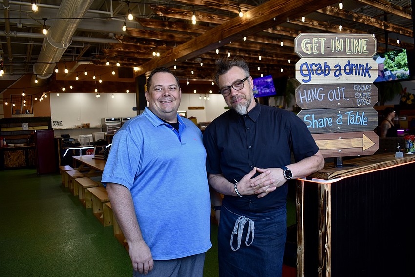 Restaurateurs Zach Zeller and Chef Evan Percoco inside their latest venture, Twisted Pit BBQ, a backyard-inspired smokehouse blending Texas tradition with Florida flair.