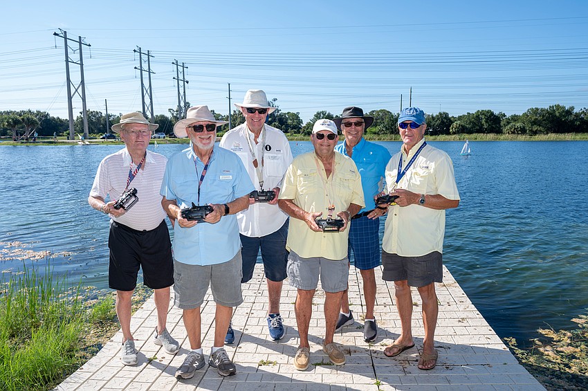 Warren Swanson, Al Knezevich, John Stryhm, Bill Schmeising, Jim Green and Chris Wingardt get ready for the next race at Nathan Benderson Park’s Green Parrot Lake.