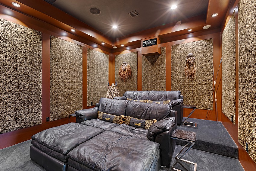 The theater, adjacent to the bar and media room, has a specially designed sound system.