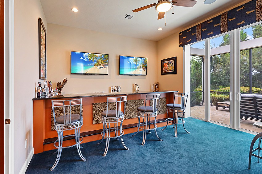 The home's bar and media room get full use during the Keemer's annual Super Bowl parties.