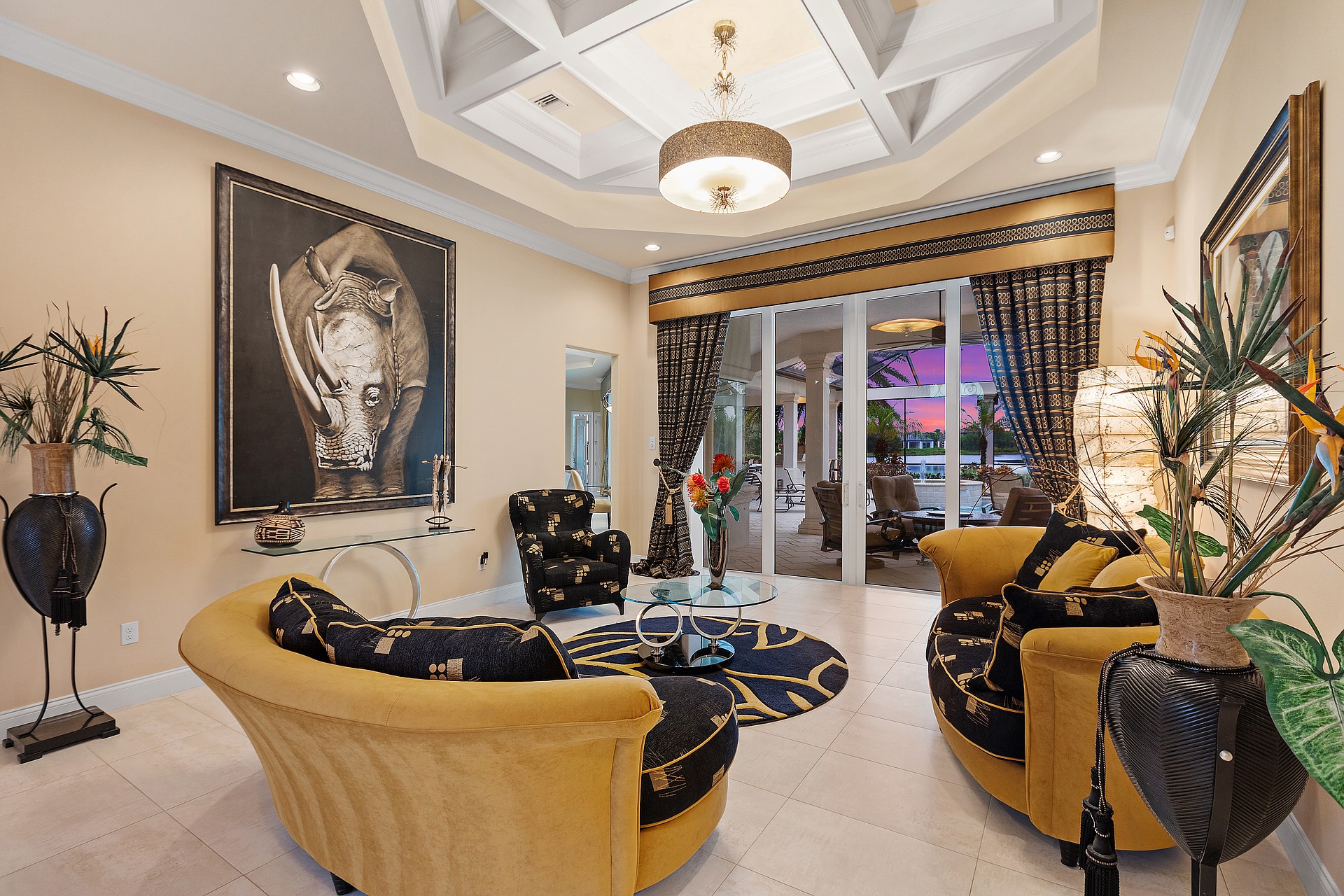 The formal living room boasts a striking painting of a rhino, acquired during a recent safari in South Africa.