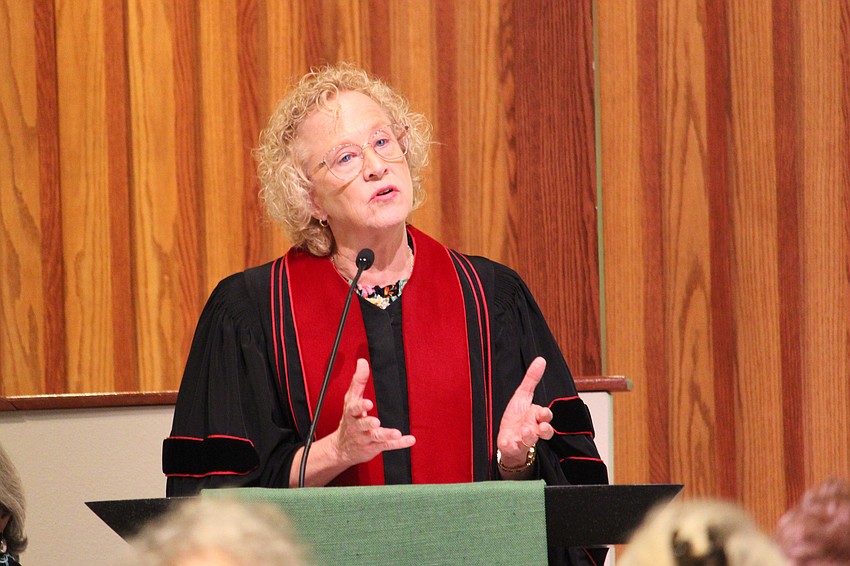 Christ Church of Longboat Key's Rev. Julia Piermont speaks to the history of Thanksgiving and the evening's charitable focus at the 45th annual interfaith Thanksgiving service on Nov. 18 at St. Armands Key Lutheran Church.