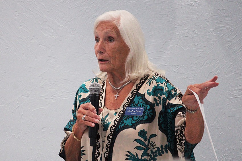 St. Mary, Star of the Sea, Catholic Church Women's Guild treasurer Marilyn Davol gives members a status update after their recent fundraising activities at a welcome-back luncheon on Nov. 18 at the church.