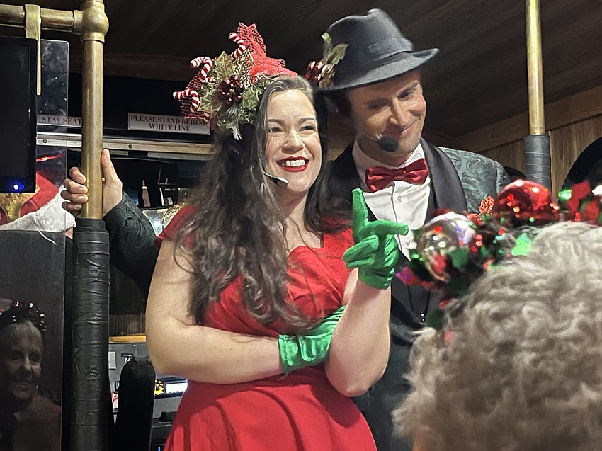 Trolley Troubadours Olivia Turpening and Austin Nichols entertain guests on Discover Sarasota Tours' 