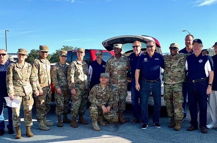 Members of the Del Webb Lakewood Ranch Association of Veterans and Military Supporters and MacDill personnel take a photo together in 2019 before the COVID pandemic changed the operation.