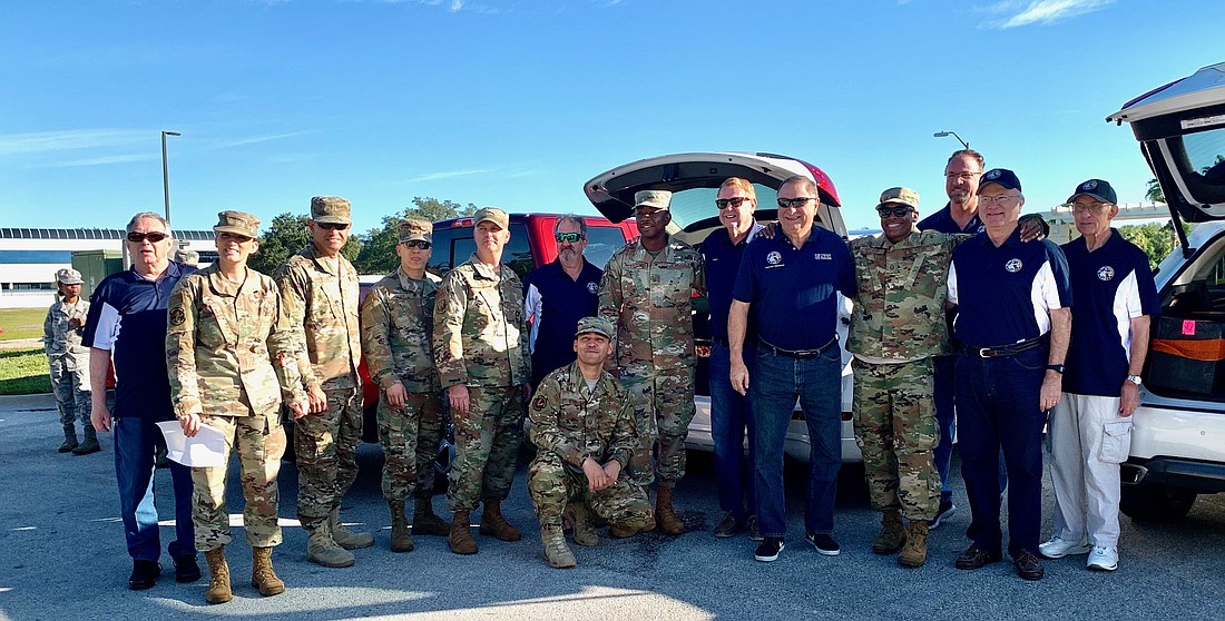 Members of the Del Webb Lakewood Ranch Association of Veterans and Military Supporters and MacDill personnel take a photo together in 2019 before the COVID pandemic changed the operation.
