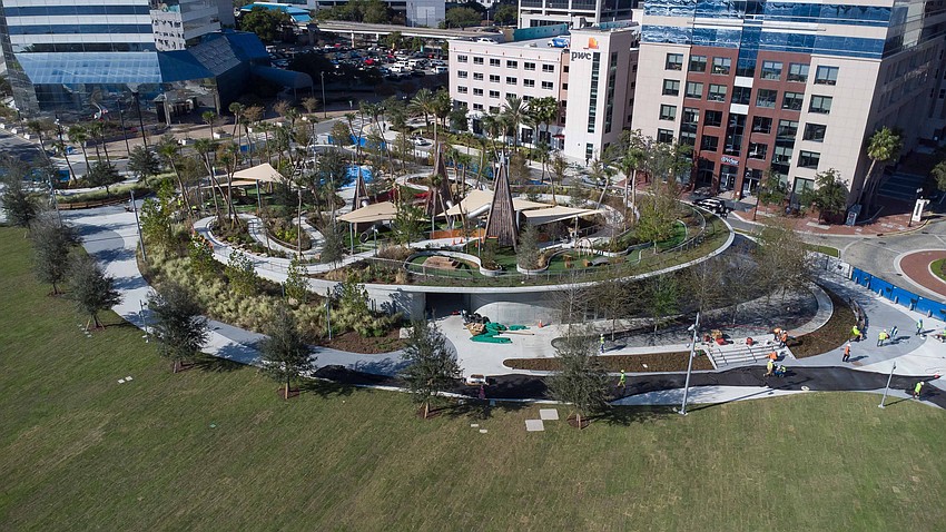 The first phase of Riverfront Plaza in Downtown Jacksonville includes a playground on top of a pavilion building, an event lawn, new bulkhead, improved Riverwalk and plaza space connecting to the Jacksonville Center for the Performing Arts.