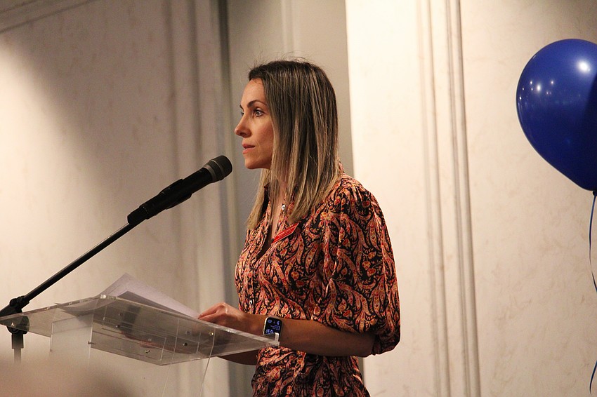 Svetlana Ivashchenko, executive director of the Children's Guardian Fund, explains what contributions to the organization allow it to do for local foster families during their annual fall luncheon on Nov. 12.