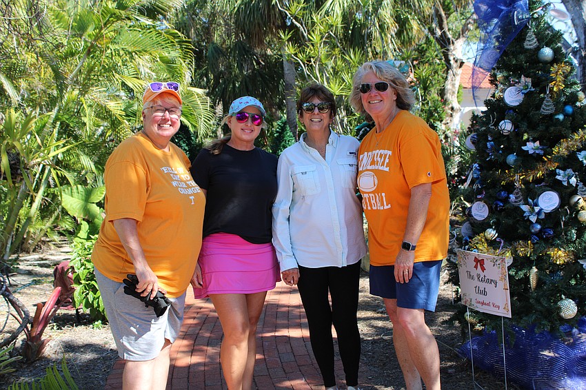 Renee Fannin, Lindy Terry, Lesley Rife and Lisa Fannin work to set up trees for this year's Christmas in the Garden at Longboat Island Chapel. The month of music and festivities kicks off 5-9 p.m. Nov. 30.
