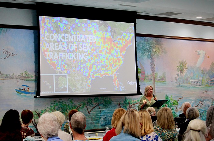 Laurie Swink, co-founder of Selah Freedom, speaks to members of the St. Mary, Star of the Sea, Catholic Church Women's Guild on Nov. 18 about how the program helps survivors of human trafficking find a path forward.