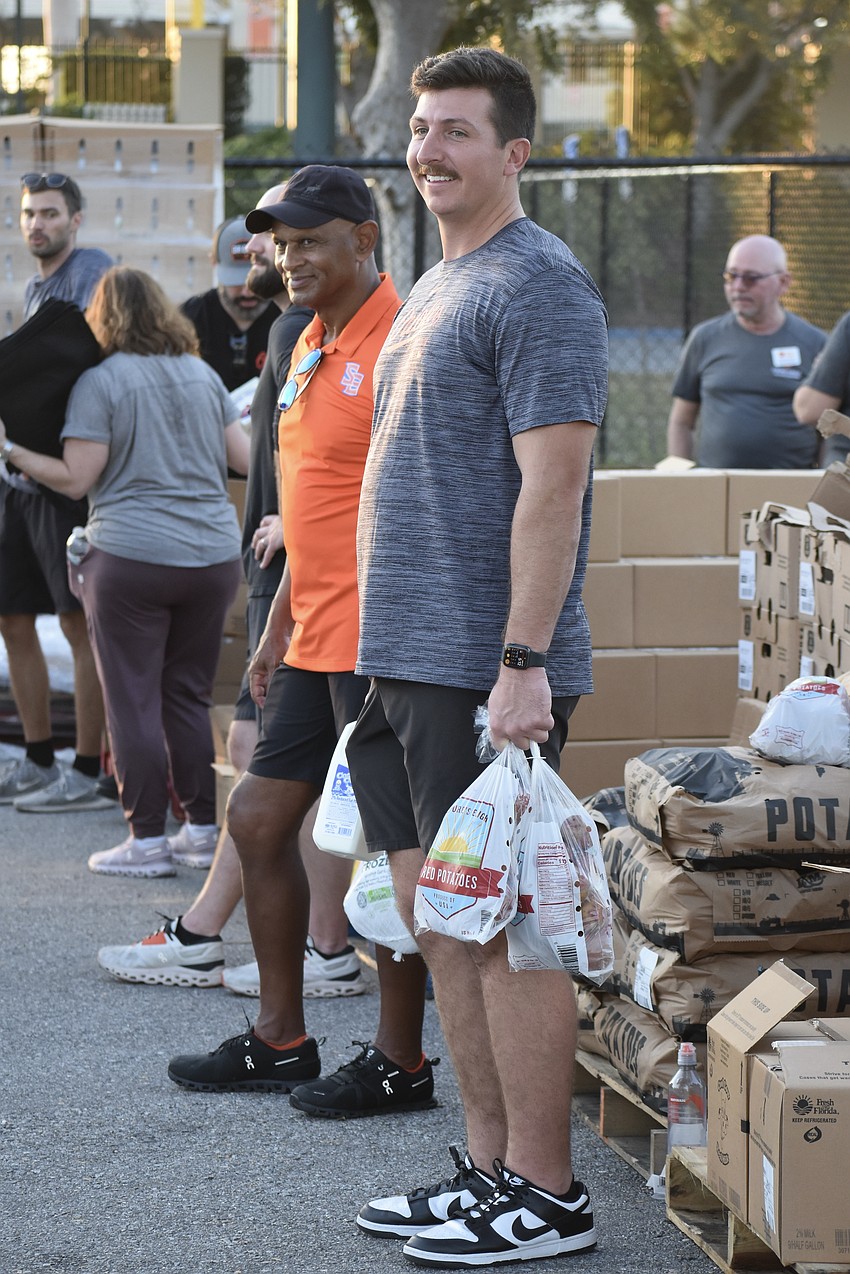 Phil Bradley and Brian Parreira await the next cars.