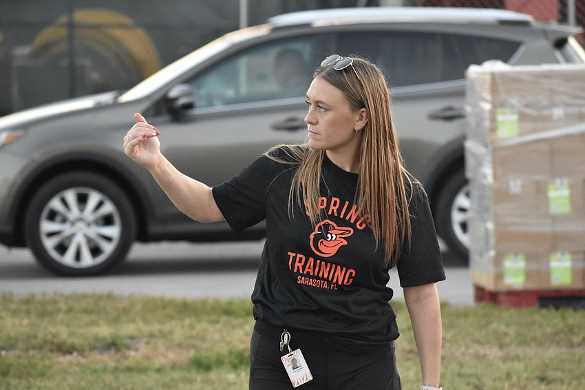 Kaelynn Miller directs traffic.