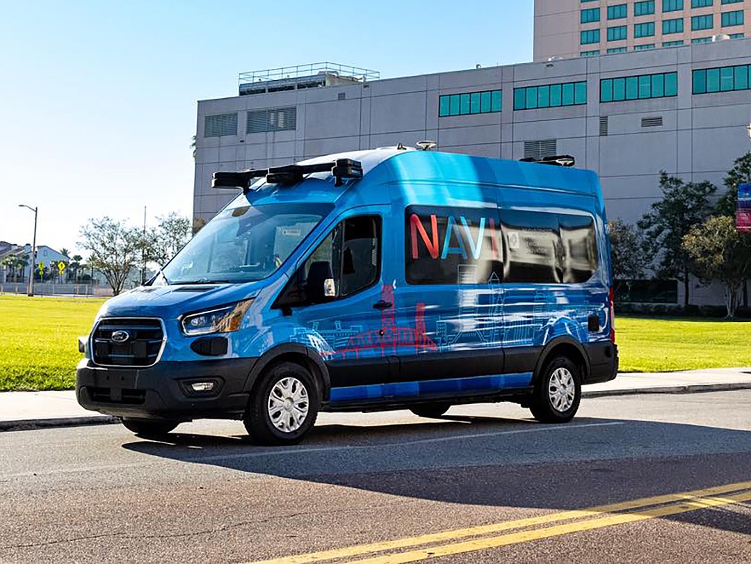 A van from the Jacksonville Transportation Authority Neighborhood Autonomous Vehicle Innovation system heads east down Bay Street in Downtown.  NAVI, which operates on a 3.5-mile route mostly along Bay Street, cost $65 million to start.
