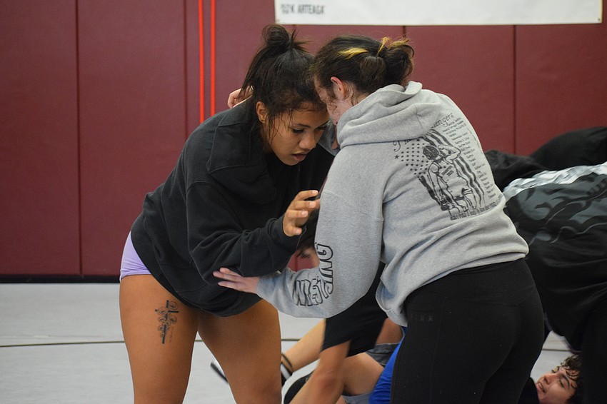 Junior Karlianna Arteaga (left) prepares to make a move during a Nov. 21 practice. She's the only returning female state qualifier for the Pirates, but one of 10 girls listed on the roster for this season.