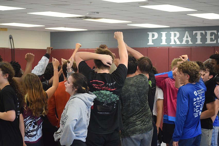 Braden River wrestling concludes a practice with a huddle at the center of the mat. Under Sharbono's guidance, the Pirates hope to be even better represented on the statewide stage when March rolls around.