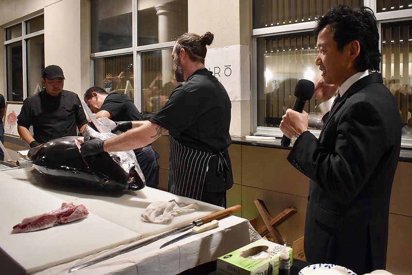 As the chefs fillet the tuna, Daniel Dokko narrates the process.