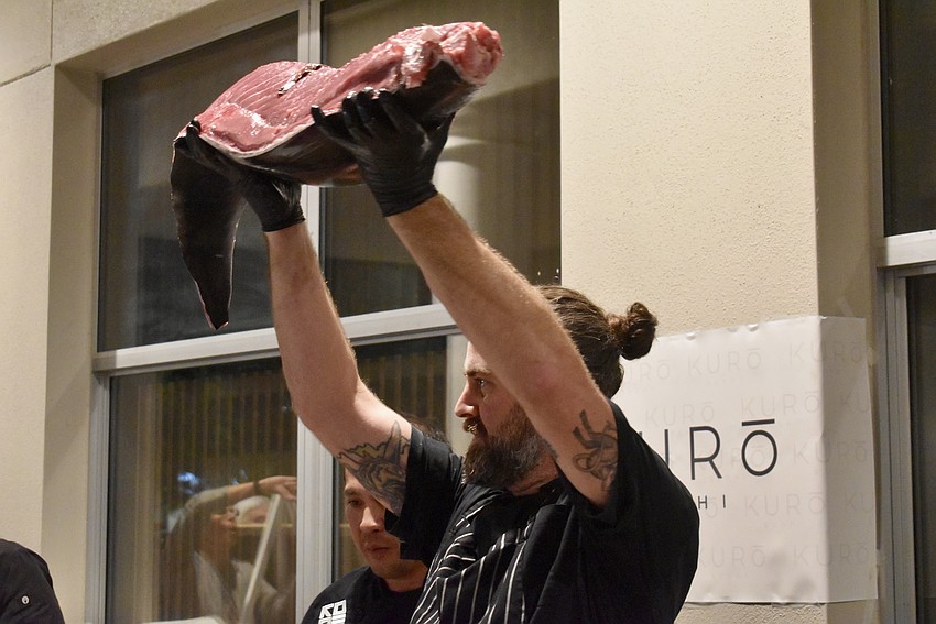 Chef Kurt Schauble holds up the first fillet.