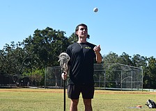 Vinny Mercadante tosses a lacrosse ball and holds his stick at Summerfield Community Park in Lakewood Ranch. He played for Cardinal Mooney in 2016-18, Marian University in 2018-19 and Florida State in 2021-23 but has since committed to coaching.