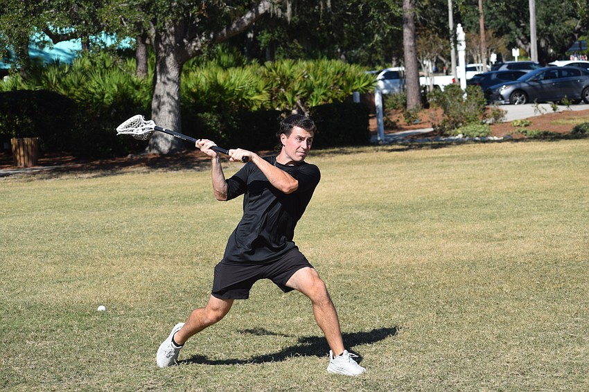 Eyeing the net, Vinny Mercadante rears back for a shot. He jumped into coaching seven years ago by getting involved in local club teams during winter and summer breaks, and began private training at the request of a neighbor.