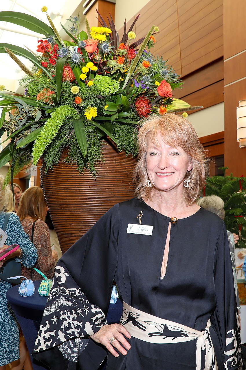 It took Becca McFadden one-and-a-half hours to put this huge floral arrangement together for the raffle prize.