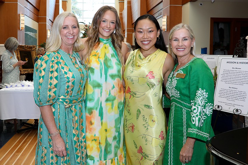 Helping out their co-chair moms Kristin Morton, left, and Kellie Menke, right, are Ivy Morton and Grace Menke.