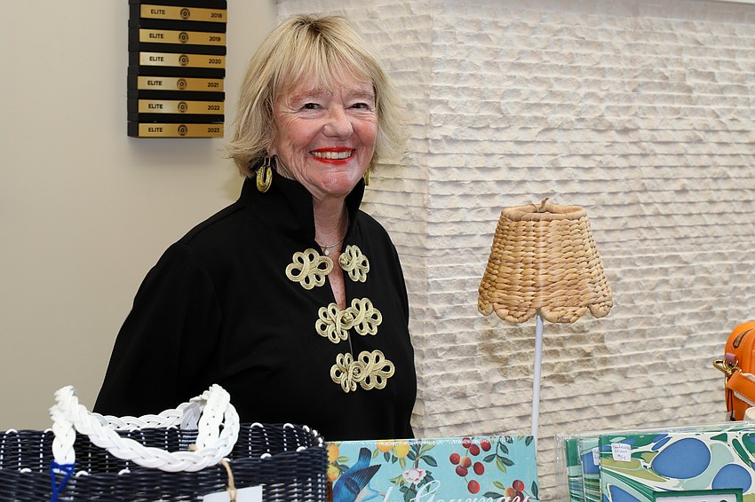 Pam Oakley with items for sale.