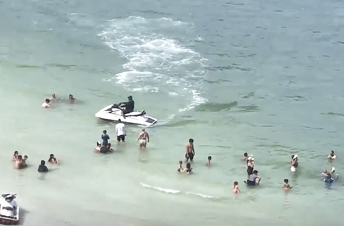 A screenshot of a video presented to the Sarasota County Commission shows personal watercraft activities in the vicinity of swimmers off South Lido Beach.