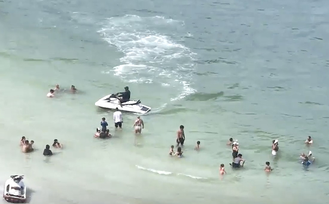 A screenshot of a video presented to the Sarasota County Commission shows personal watercraft activities in the vicinity of swimmers off South Lido Beach.