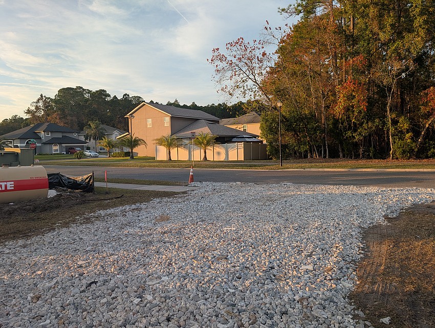 The entrance to the Chick-fil-A is near homes in the North Creek subdivision.