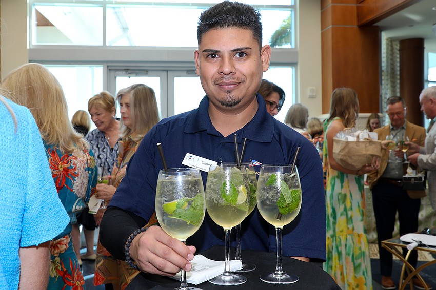SYC's Daniel Luna helps keep everyone hydrated.