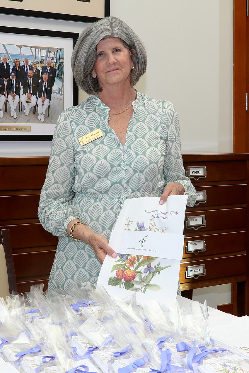 Meg Ferlise sells flower-related items at the merch table.