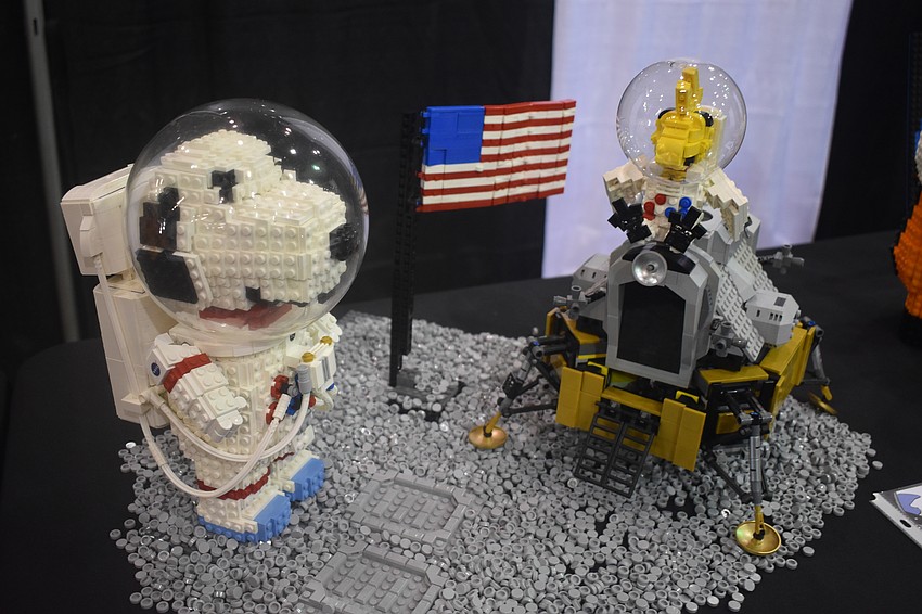 Snoopy and Woodstock land on the moon in a piece by Lia Chan.