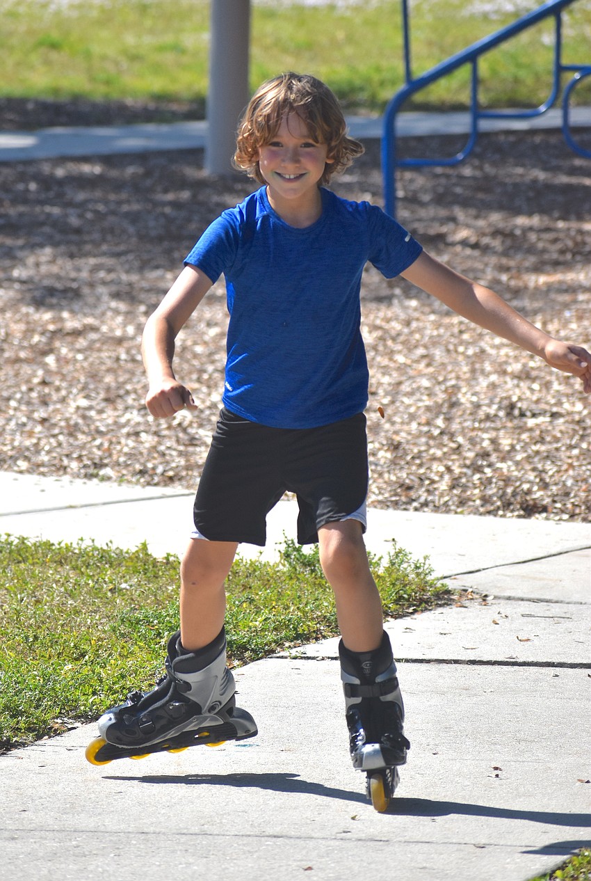 Greenbrook's Benjamin Pearsall, 9, spends the majority of his time at the park making his rounds on his rollerblades. He says he loves to skate as it is a much easier form of transportation.