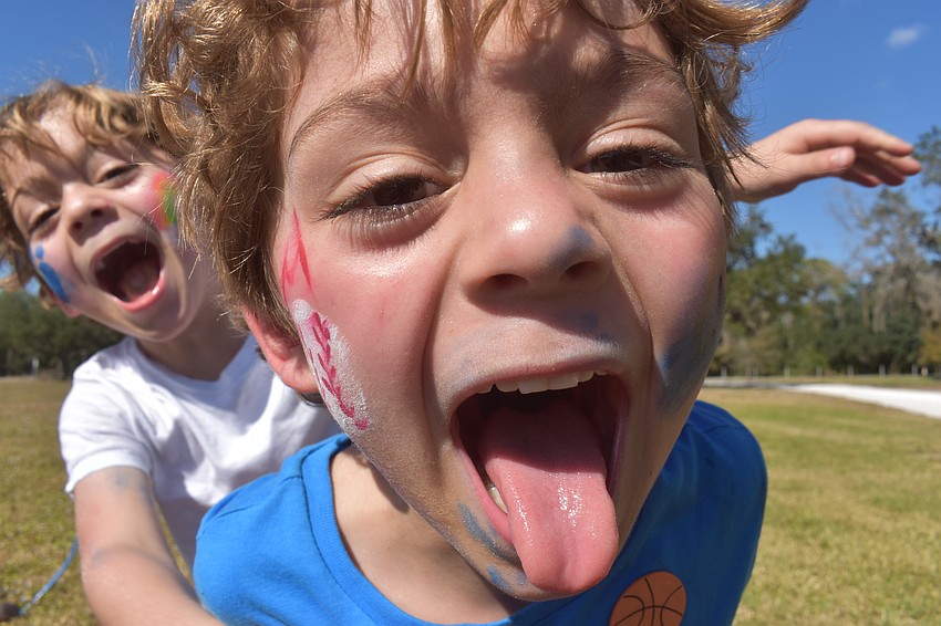 Logan and Henry Smith, 5-year-old Greenbrook twins, enjoy the fresh air to get their energy out.