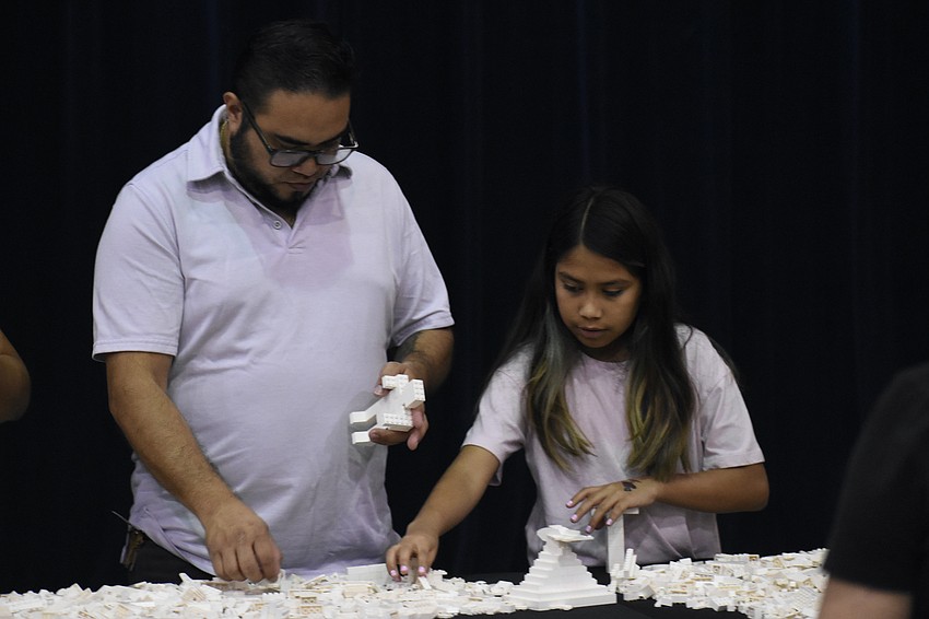 Oscar Gonzalez and Julietta Gonzalez, 10, build with Legos.