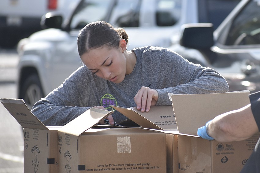 Ava Bruno unboxes some of the supplies.