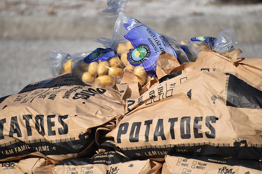 Potatoes are stacked, ready for distribution.
