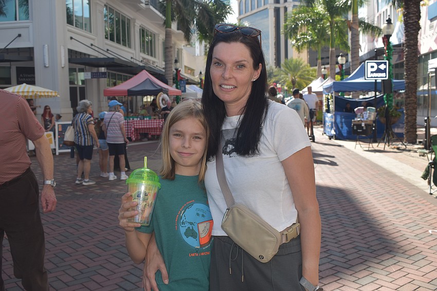 Julia Lesikar and Elijah Lesikar, 8, enjoy the Farmer's Market.