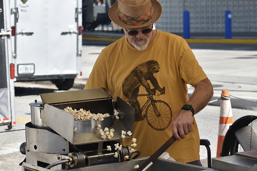 Casey Walton of Kettle Cornball makes a fresh batch of popcorn.